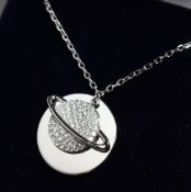 A SILVER PLANET PENDANT AND CHAIN