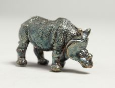 A MINIATURE SILVER RHINO 4.5cm long.