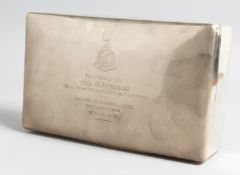 A RECTANGTULAR SILVER CIGARETTE BOX with domed top and rounded corners, cedarwood liner, 9ins