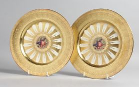 A GOOD PAIR OF AYNSLEY FRUIT PLATES with gold borders. 10ins diameter.