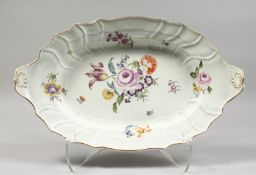A VERY GOOD LARGE MEISSEN OVAL DISH painted with flowers. Cross swords mark in blue 18ins long.