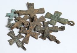 TEN SMALL ROMAN IRON CROSSES. 1.25ins long.