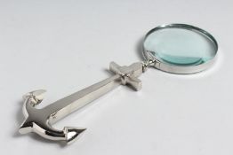 A MAGNIFYING GLASS with ANCHOR handle.