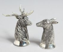 A PAIR OF .800 WHITE METAL STAG AND DEER SALTS AND PEPPERS.