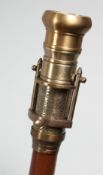 A NOVELTY WALKING STICK with COMBINATION COMPASS AND TELESCOPE HANDLE. 38.75ins long.
