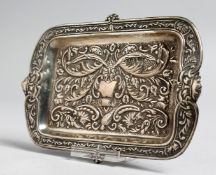 AN EMBOSSED SILVER RECTANGULAR PIN TRAY, 6ins long.