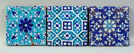 THREE 19TH CENTURY INDIAN MULTAN GLAZED POTTERY TILES, each approx. 15cm square.