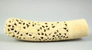 A GOOD BURMESE CARVED AND PIERCED DHA HANDLE, carved with native dancing figures and mythological