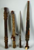 A COLLECTION OF FOUR TRIBAL WEAPONS, possibly North African, including three daggers and one darts