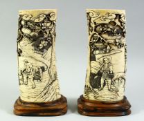 A PAIR OF JAPANESE MEIJI PERIOD CARVED IVORY TUSK VASES on fitted keyaki wood stands, circa 1890,