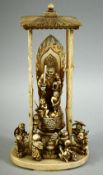A JAPANESE MEIJI PERIOD CARVED IVORY BUDDHISTIC OKIMONO, depicting a shrine of Fudo Myo-o (Acala)