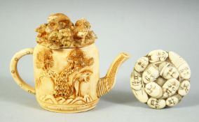 A JAPANESE CARVED IVORY ROUNDEL with noh masks, possibly a lid, 6cm diameter, together with a