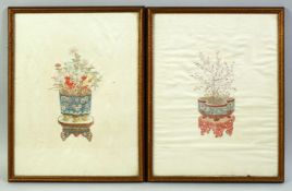 TWO CHINESE EMBROIDERED SILK PICTURES, finely embroidered depicting flowers in jardinieres on