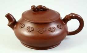 A CHINESE YIXING TEAPOT AND COVER, the inner lid and base with impressed marks, 16cm from handle