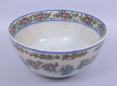 A LARGE 19TH CENTURY PERSIAN QAJAR BOWL, in the chinese style, painted with bands of flowers, 30cm