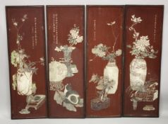 FOUR LARGE CHINESE CARVED AND STAINED WOODEN PANELS, depicting various flora, each with inscription