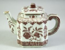 A CHINESE UNDERGLAZE RED TEAPOT, with floral decoration, six character mark to base, 17cm long.