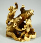 A JAPANESE CARVED IVORY OKIMONO, depicting a group of rats, 6.5cm wide.