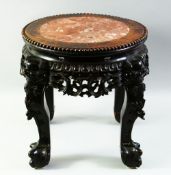 A CHINESE CARVED HARDWOOD AND MARBLE INSET STAND, with pierced frieze and supported on four carved