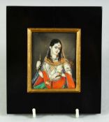 AN INDIAN MINIATURE FEMALE PORTRAIT ON IVORY, painted with gilt highlights and encased within an