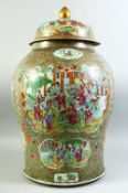 A VERY LARGE CHINESE CANTON FAMILLE ROSE PORCELAIN JAR AND COVER, decorated with multiple panels