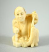 A JAPANESE CARVED IVORY NETSUKE, of a seated fisherman, 4cm high.