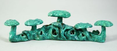 A CHINESE TURQUOISE GLAZE BRUSH REST, with impressed mark to base, 19.5cm long.