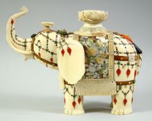 A LARGE JAPANESE MEIJI PERIOD CARVED IVORY AND SHIBAYAMA CAPARISONED ELEPHANT, circa 1880, the