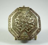 AN ISLAMIC WHITE METAL OCTAGONAL QURAN AMULET BOX, possibly silver, 7.5cm diameter.