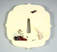 A JAPANESE MEIJI PERIOD SHIBAYAMA & IVORY TSUBA, weighing approx. 50gm, 3.3in x 3.2in.