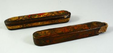 TWO PERSIAN QAJAR QALAMDANS PEN BOXES, each 22cm long.