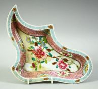 A CHINESE FAMILLE ROSE PORCELAIN UNUSUAL SHAPED DISH, painted with flowers and with gilt highlights,