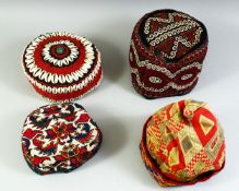 FOUR VARIOUS UZBEK AND TURKAMAN EMBROIDERED HATS.