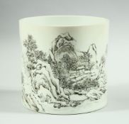 A LARGE CHINESE PORCELAIN CYLINDRICAL BRUSH POT, decorated with a landscape scene, 15.5cm high.