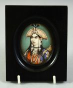AN INDIAN MINIATURE OVAL PORTRAIT OF A FEMALE FIGURE on ivory, in an ebonised wood frame and glazed,