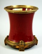 A CHINESE SANG DE BOUEF PORCELAIN BRUSH POT, with ormolu mounts, 18cm high.