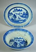A CHINESE BLUE AND WHITE PORCELAIN OVAL BASKET AND STAND, basket 22.5cm wide.
