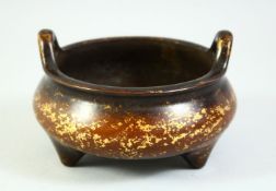 A CHINESE GOLD SPLASH BRONZE CENSER, with six character mark to base, 13cm diameter.
