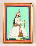 AN INDIAN MINIATURE PAINTING OF A NOBLEMAN - stood in his attire holding his stick - framed