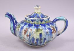 A JERUSALUM GLAZED POTTERY TEA POT, 19cm wide from spout to handle.
