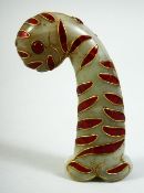 AN INDIAN GREEN HARDSTONE DAGGER HANDLE, onlaid with red stones and wirework decoration, 13cm long.