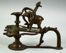 A FINE 17TH / 18TH CENTURY SOUTH INDIAN BRONZE OIL LAMP, with elephant and rider finial, 16cm long.
