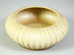 A CHINESE CREAM GROUND RIBBED PORCELAIN BOWL, with four character mark to base, 13.5cm diameter.