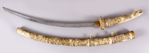 A LARGE JAPANESE MEIJI PERIOD CARVED SECTIONAL IVORY KATANA / SWORD, carved to depict an array of