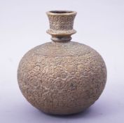 A FINE INDIAN BRASS GLOBULAR HUQQA BASE, with embossed floral decoration, 16cm high.