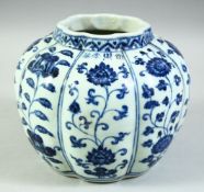 A CHINESE BLUE AND WHITE PORCELAIN PETAL SHAPE JAR, the ribbed body decorated with panels of flowers