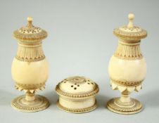 A GOOD NEAR PAIR OF INDIAN TURNED IVORY PEDESTAL POUNCE POTS, 8cm high, and a similar pot and cover,