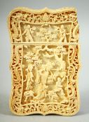 A CHINESE CANTON CARVED IVORY CARD CASE, carved with female figures and animals beneath a tree