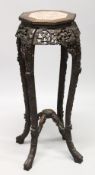 A CHINESE ROSEWOOD AND MARBLE INSET OCTAGONAL SHAPED VASE STAND, with bead carved top, pierced and