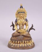 A SMALL 20TH CENTURY TIBETAN GILDED BRONZE BUDDHA, 10cm.